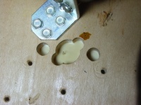 Image # 29709: Junk Yard Prototype Playfield Underside 
(Picture shows holes in a prototype playfield for a pop bumper in the upper right hand corner of the playfield.)