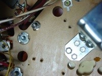 Image # 29711: Junk Yard Prototype Playfield Underside 
(Picture shows holes in a prototype playfield for scoring switches in the upper right hand corner of the playfield.)
