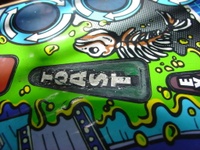 Image # 29716: Junk Yard Prototype Playfield Insert Detail 
(Toast insert is green on this prototype playfield, but white on production games.)