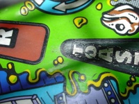 Image # 29717: Junk Yard Prototype Playfield Insert Detail 
(Toast insert is green on this prototype playfield, but white on production games.)