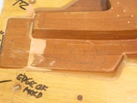 Image # 70324: Medieval Madness Right Ramp Prototype Mold 
(This solid wood tool was used to prototype thermoform the right plastic ramp (part number 03-9680.8). It measures approximately 24 x12 x 9 inches including the wood base.)
