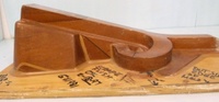 Image # 70326: Medieval Madness Right Ramp Prototype Mold 
(This solid wood tool was used to prototype thermoform the right plastic ramp (part number 03-9680.8). It measures approximately 24 x12 x 9 inches including the wood base.)