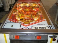 Image # 36537: red Arrow Illuminated Playfield 
(Not all pop bumper caps match the ones on the game in the flyer.)