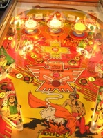 Image # 36536: red Arrow Illuminated Playfield 
(Not all pop bumper caps match the ones on the game in the flyer.)