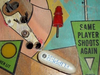 Image # 49889: Cabaret Sample Game - Detail 
(The extra holes near each flipper likely were drilled by an operator to allow longer 3-inch flippers to be installed.)