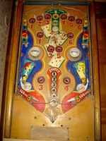 Image # 27670: Canasta Playfield 
(This playfield is missing the two flipper-shaped posts at the very top center of the playfield, above the white post, and where a rubber ring fits around all three of them.)