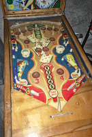 Image # 75418: Canasta Playfield 
(This playfield is missing the two flipper-shaped posts at the very top center of the playfield, above the white post, and where a rubber ring fits around all three of them.)