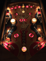 Image # 75423: Canasta Illuminated Playfield 
(This playfield is missing the two flipper-shaped posts at the very top center of the playfield, above the white post, and where a rubber ring fits around all three of them.)