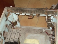 Image # 65436: Grand Slam Inside Cabinet - Front 
(The knocker is located to the left of the chimes in this picture as the part of the chime unit that is closest to the cabinet wall. The left flipper switch and it red wires are shown here detached from the cabinet wall.)