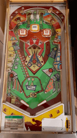 Image # 74345: Running Horse Playfield 
(The slingshot plastics and the center plastic are reproduction. The cabinet and the apron have both been repainted. The game in the flyer used white rubber rings.)
