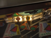 Image # 53941: Brave Team Illuminated Standup Targets 
(The red drop target on the far right is dropped, showing the captive ball rail. Serial number 4128.)