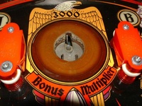 Image # 25060: Mata Hari Sample - Kick-Out Hole 
(Plastic playfield. Serial number 'EM1230'.)