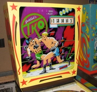 Image # 43139: T.K.O. Backglass 
(This game was photographed at Chicago's Pinball Expo 2009.)