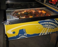 Image # 55543: Close Encounters of the Third Kind Prototype Game - Cabinet - Right 
(This game has no serial number. Notice the blue and yellow backbox stripes on its front.)
