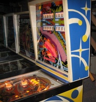 Image # 55542: Close Encounters of the Third Kind Prototype Game - Backbox - Right 
(This game has no serial number. Notice the blue and yellow backbox stripes on its front.)