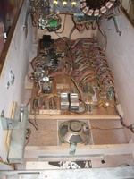 Image # 58255: Close Encounters of the Third Kind Sample Game - Inside Cabinet 
(The unused jack to the right of the Total Play meters is for a chime unit. Serial number 01097 S.)