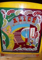 Image # 42746: Alice in Wonderland Backbox Front 
(The trim was painted yellow and appears to have been done a long time ago. This might mean the cabinet was repainted, but the owner stated the paint and pattern very much look authentic.)