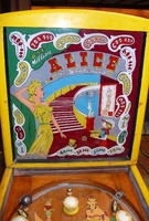 Image # 42745: Alice in Wonderland Backglass 
(The trim was painted yellow and appears to have been done a long time ago. This might mean the cabinet was repainted, but the owner stated the paint and pattern very much look authentic.)