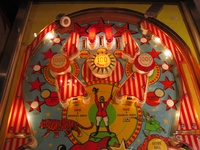 Image # 39527: Circus Illuminated Upper Playfield 
(The orange and red 1000-point bumper caps are reversed on this game as compared to the flyer. Serial number 1841.)