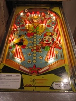 Image # 39526: Circus Illuminated Playfield 
(The orange and red 1000-point bumper caps are reversed on this game as compared to the flyer. Serial number 1841.)