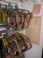 Image # 49542: Aces Top Inside Backbox - Detail 
(Tag is stamped 'Aces High'. Cabinet serial number AH-1595.)