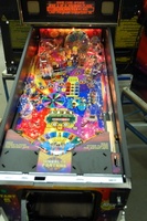 Image # 36235: Wheel Of Fortune Early Production on Assembly Line 
(Images 36235 through 36269 show one of the first ten or so games being assembled at the factory. Some playfield parts may have not yet been installed on this playfield.)