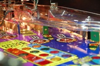 Image # 36248: Wheel Of Fortune Early Production on Assembly Line 
(Images 36235 through 36269 show one of the first ten or so games being assembled at the factory. Some playfield parts may have not yet been installed on this playfield.)