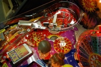 Image # 36255: Wheel Of Fortune Early Production on Assembly Line 
(Images 36235 through 36269 show one of the first ten or so games being assembled at the factory. Some playfield parts may have not yet been installed on this playfield.)