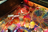 Image # 36239: Wheel Of Fortune Early Production on Assembly Line 
(Images 36235 through 36269 show one of the first ten or so games being assembled at the factory. Some playfield parts may have not yet been installed on this playfield.)