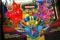 Image # 36240: Wheel Of Fortune Early Production on Assembly Line 
(Images 36235 through 36269 show one of the first ten or so games being assembled at the factory. Some playfield parts may have not yet been installed on this playfield.)