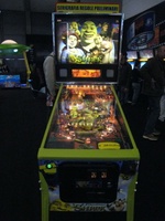 Image # 37808: Shrek� Sample Game - Illuminated Front View 
(Backbox topper reads 'preliminary graphics and game rules'. Serial number E 216298.)