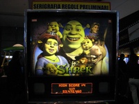Image # 37806: Shrek� Sample Game - Illuminated Backglass 
(Backbox topper reads 'preliminary graphics and game rules'. Serial number E 216298.)