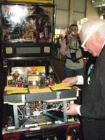 Image # 43389: Indiana Jones Sample Game - Gary Stern Making Adjustments 
(Serial number E 216297. After the show, the game was shipped back to Stern in the USA.)