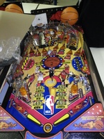 Image # 47040: NBA Playfield - Chinese Export 
(These export games have no center spinning disc, no aerial habitrail, the MVP targets are not drop targets, the STAR targets are square instead of round, and the slingshot flasher caps are orange instead of red.)