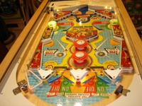 Image # 30193: Contest Playfield, Showing Cardholder Lamps 
(Illuminated lamps under the cardholder shine onto the playfield.)