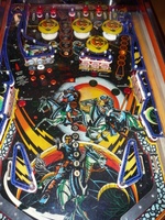 Image # 40690: Cosmic Gunfight Orange Version Playfield 
(The owner of this game states he has clearcoated the playfield and applied reproduction drop target stickers.)