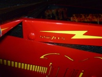 Image # 52374: AC/DC (Let There Be Rock Limited Edition) Cabinet Trim - Detail 
(The initials of the designer and programmer are evident here. Serial number 234387.)