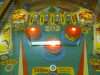 Image # 56435: Cue Ball Upper Playfield 
(The two white targets and the green and yellow pop bumper platters are not original to this game.)