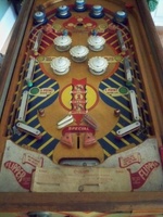 Image # 39865: Cyclone Playfield 
(The game flyer shows that both flippers are supposed to be white. The posts nearest the flippers are not original to this game. Serial number 053123C.)