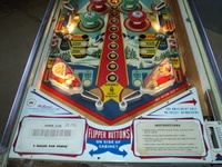 Image # 49930: Alpine Club Illuminated Lower Playfield 
(The two white posts below the flippers were added after the game left the factory. Serial number 22236.)