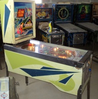 Image # 49931: Alpine Club Cabinet - Left 
(The two white posts below the flippers were added after the game left the factory. Serial number 22236.)