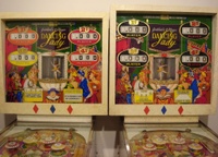 Image # 34723: Dancing Lady Sample and Production Backboxes 
(Besides having multiple colors around the score reels, the Sample backglass and backbox were slightly shorter than the production version. Most of the artwork appears to have been redrawn in the production glass.)