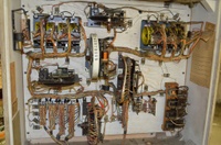 Image # 61049: Discotek Inside German Backbox 
(The bell has been removed from the upper left corner of this backbox, leaving the solenoid in the mounting bracket. Serial number DK 1092.)