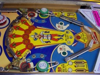 Image # 30300: Dodge City Lower Playfield 
(The posts below the round green bumpers have been moved from their original positions. The kick-out holes have been repainted in black.)