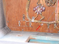 Image # 48481: Doodle Bug Inside Early Production Backbox - Detail 
(The lamp socket and its wiring are missing for the 10th Ball To Play. Serial number 65420.)