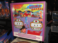 Image # 83596: Double Barrel Backglass 
(The backbox has been repainted. Photographed at the 2013 Pinball Expo in Chicago.)