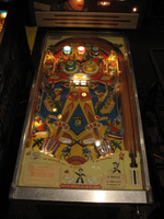 Image # 83599: Double Barrel Illuminated Playfield 
(The backbox has been repainted. Photographed at the 2013 Pinball Expo in Chicago.)