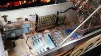 Image # 67926: Dyn O' Mite Inside Cabinet - Left Side 
(A free-play switch has been added to the credit button after the game left the factory.)