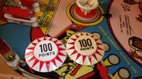 Image # 68578: Dyn O' Mite Pop Bumper Cap Comparison 
(A reproduction pop bumper cap on the left is presented here to illustrate its difference from the manufacturer's original cap on the right.)
