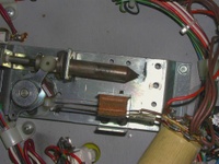 Image # 58802: Eight Ball Deluxe Prototype Game - Under Playfield - Detail 
(Flipper mechanism with coil removed to see the tapered plunger. Serial number EED9201.)